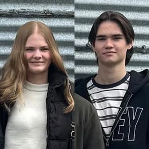 Chloé and Zack, smiling outdoors